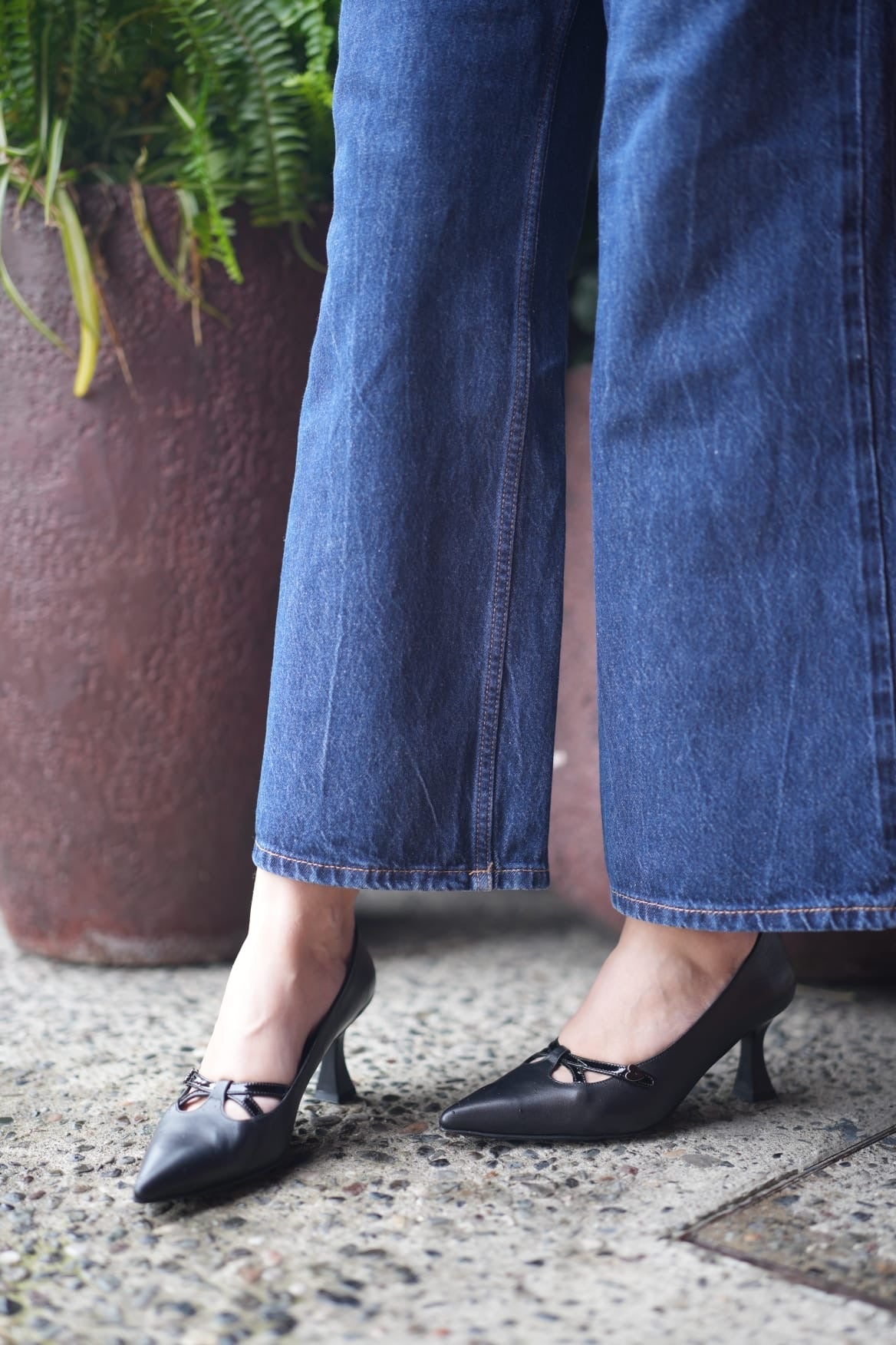 Women’s Black Leather Stilettos with Curved Heel and Buckle Accent